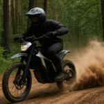 Electric dirt bike helmet laws in action — rider speeding through forest trail kicking up dust, fully geared with helmet.