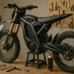 Detailed image of an electric dirt bike in an outdoor setting, representing an electric dirt bike spring tune-up guide with focus on seasonal maintenance and performance optimization.