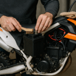 How to maintain electric dirt bike battery by cleaning the terminals with a brush for optimal performance.